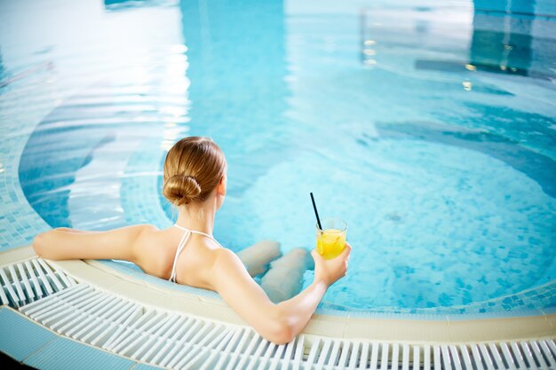 Rear view of woman in the hot tub