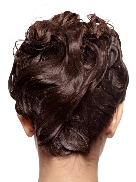 Rear view of woman's head with wet hair - isolated on white wall