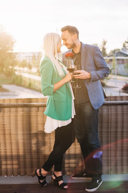 Rear view of young couple standing in balcony