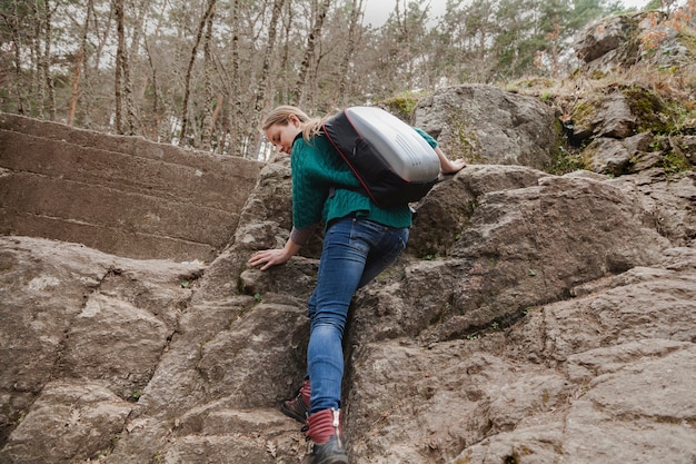 Rear view of young woman descending