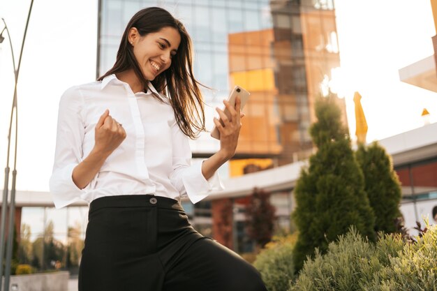 Rearview of businesswoman enjoying her great results