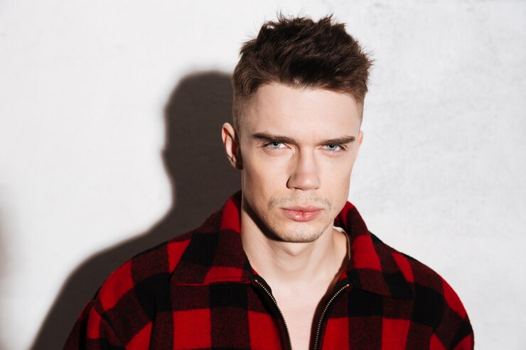 Free Photo rebel man in plaid shirt posing