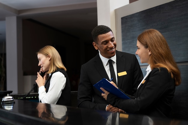 Free photo receptionists in elegant suits during work hours