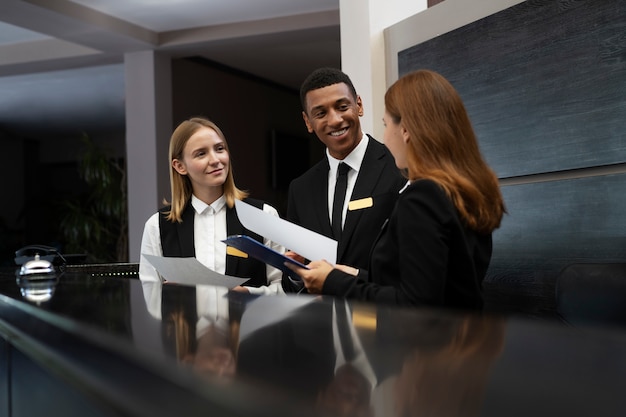 Free photo receptionists in elegant suits during work hours