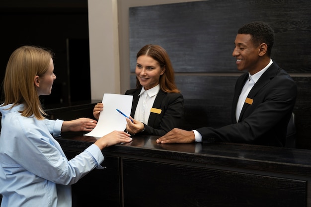 Free photo receptionists in elegant suits during work hours