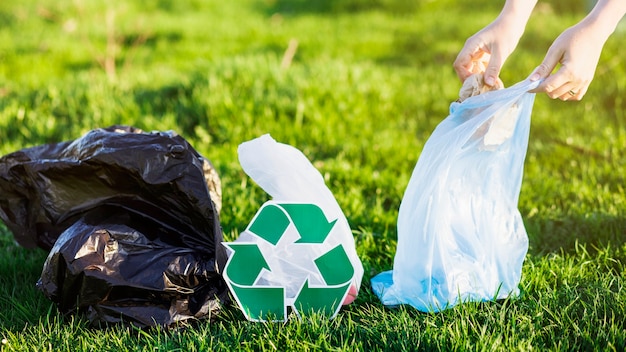 Recycle concept with woman collecting trash