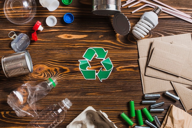 Recycle items on brown wooden textured background