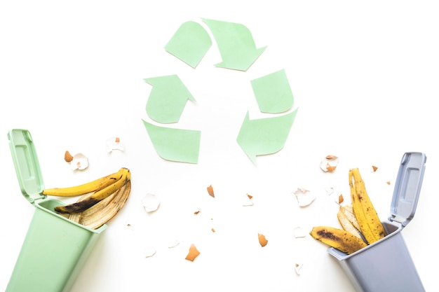 Free photo recycle logo and trash bins