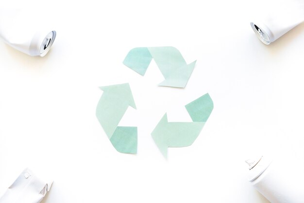 Free photo recycle logo with garbage in corners