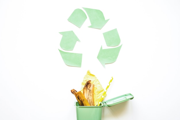 Recycle symbol with garbage bin