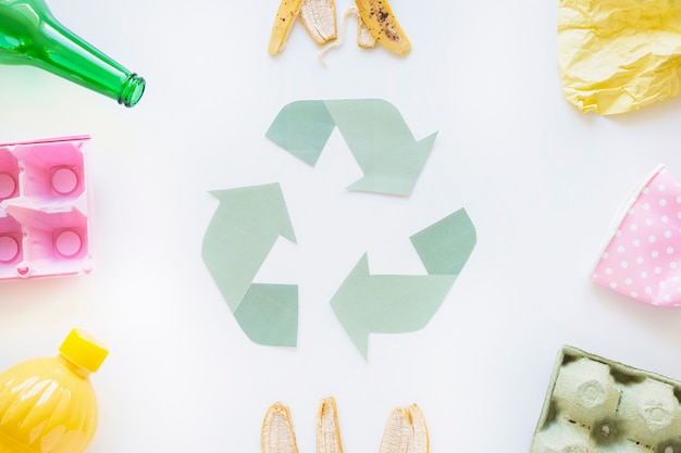 Free photo recycle symbol with garbage