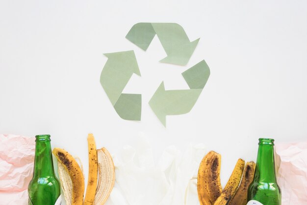 Recycle symbol with garbage 