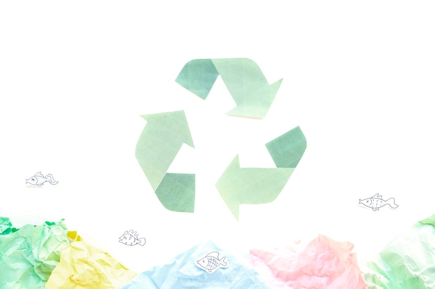 Recycle symbol with papers 