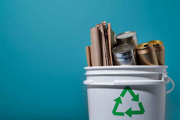 Recycling with plastic bottles and cans in container