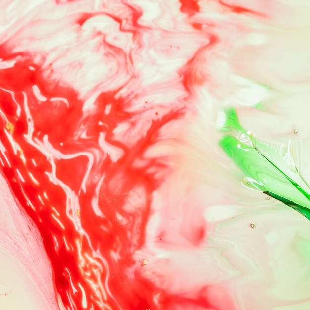 Free photo red abstract waves with a green drop