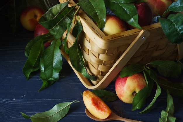 Red apples in brown woven basket