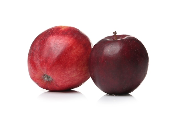 Red apples on a white surface