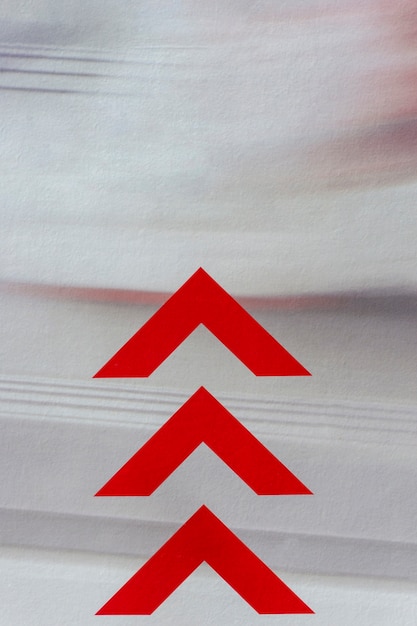 Free photo red arrows on motion blur background