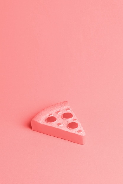 Free photo red background with piece of pizza