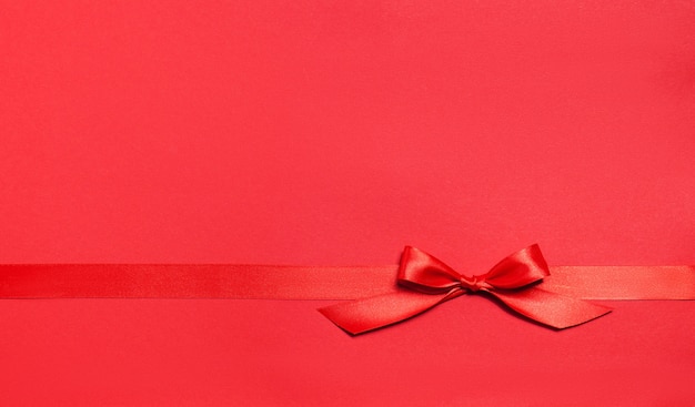 Red background with a red tie