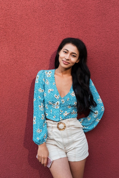 Red background with woman smiling