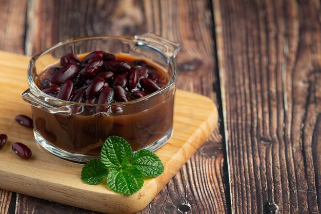 red bean boiled in glass bowl place on wooden cutting board