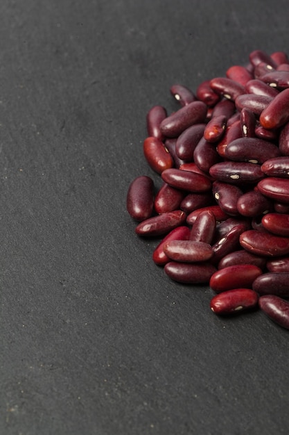 Free photo red beans on the black table