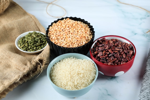 Red beans, rice and peas in colorful bowls