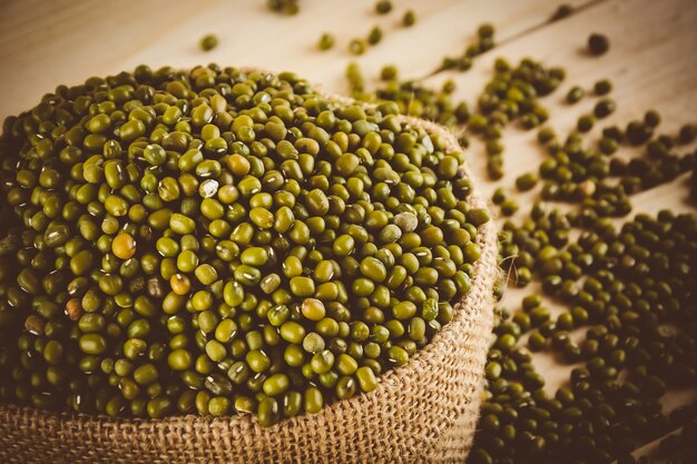 red  beans on wood background - soft focus with vintage film filter