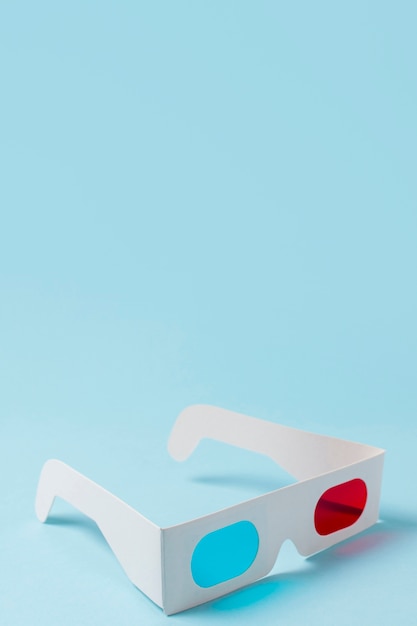 Red and blue 3d glasses on blue background