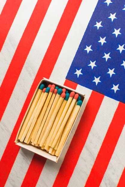 Red and blue matchsticks box on usa flag