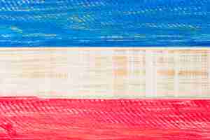 Free photo red and blue usa painted flag on wooden plank for independence day