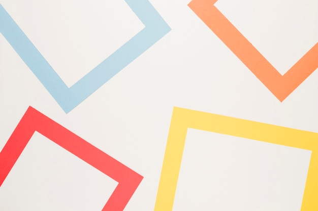 Red blue yellow orange frames on white surface