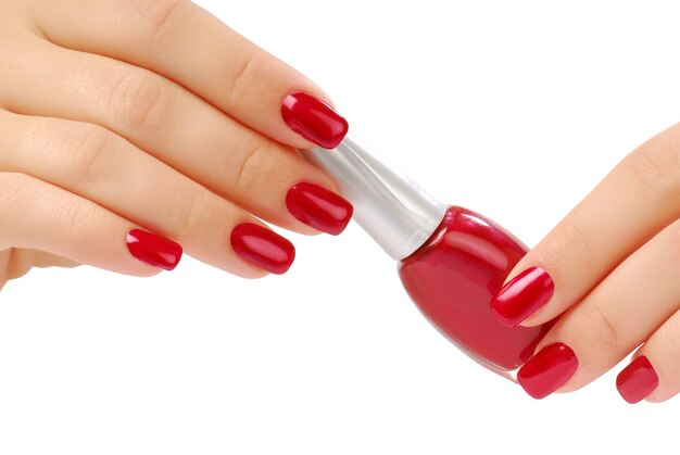 Red bottlel of nail polish