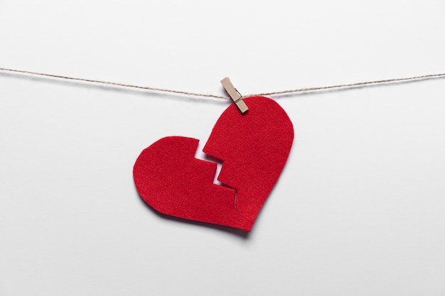 Free photo red broken heart with hook