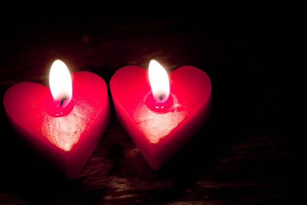 Red burning heart shaped candles