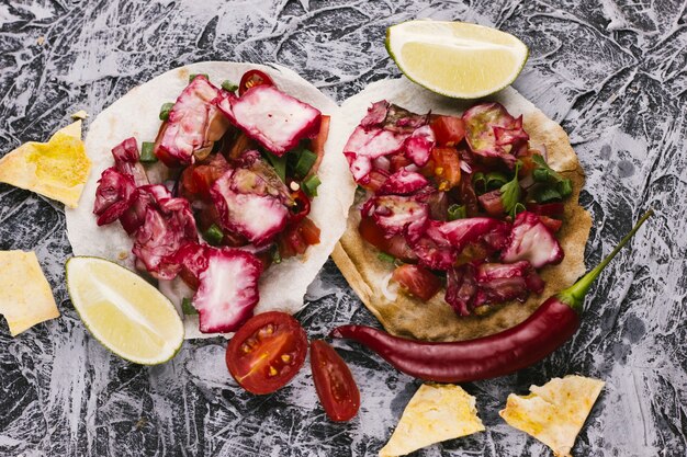 Red cabbage, lemon and tortillas top view