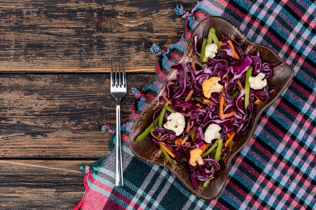 red cabbage salad on color cloth top view