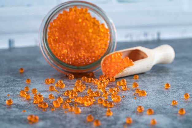 Red caviar in a glass jar