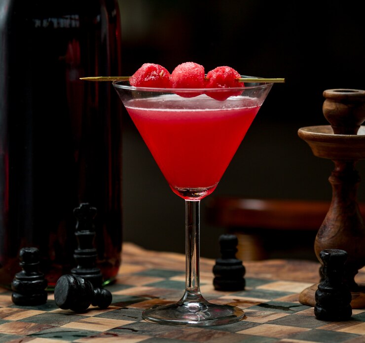 Free Photo red cherry cosmopolitan with cherry berries on the top
