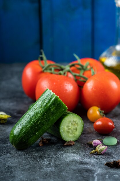 Red cherry tomatoes and green cucumbers