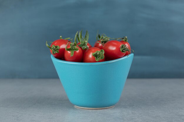 Red cherry tomatoes isolated.