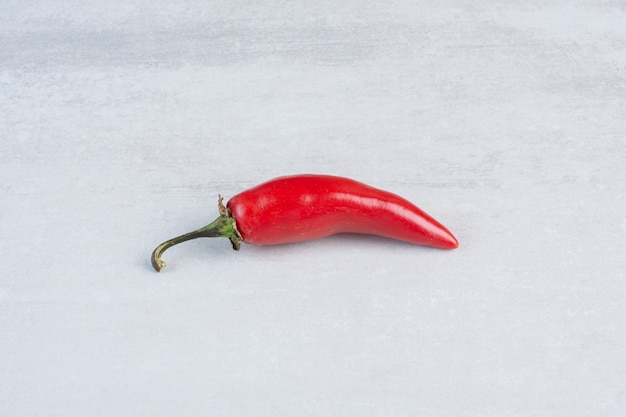 Red chili pepper on stone background. High quality photo