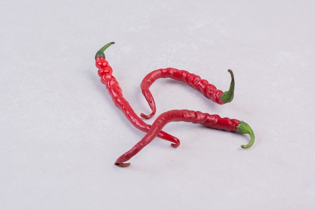 Free photo red chili pepper on white surface