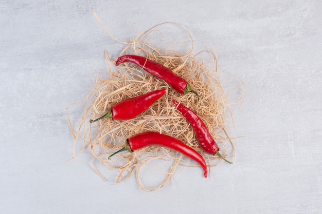 Free photo red chili peppers on stone background. high quality photo