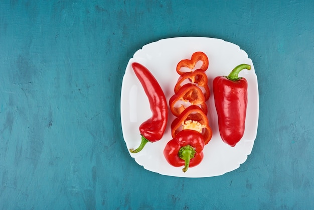 Red chili peppers in a white plate.