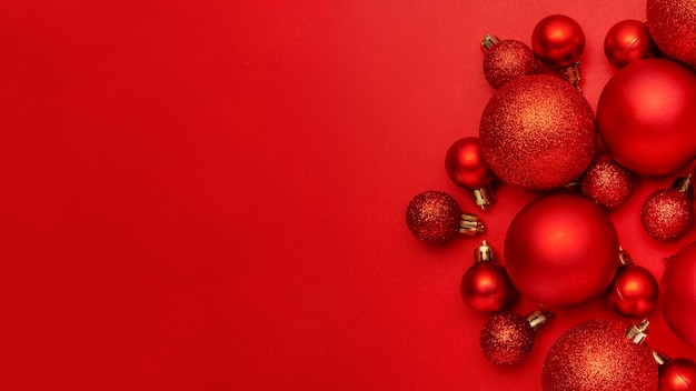 Red Christmas balls on red table