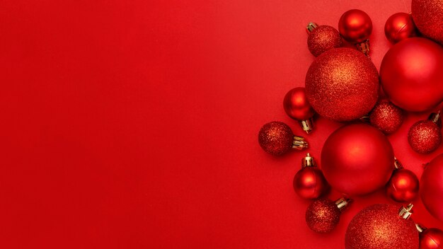 Red Christmas balls on red table