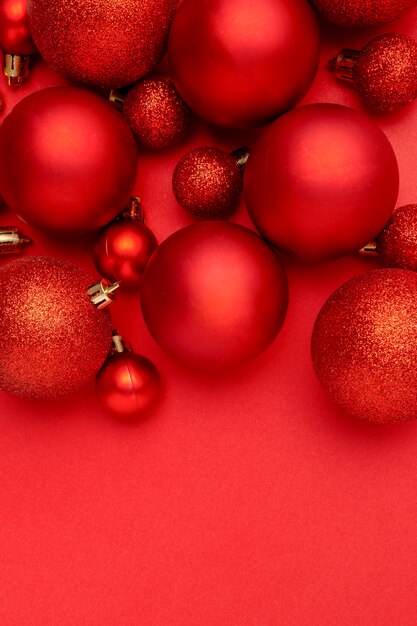 Red Christmas balls on red table