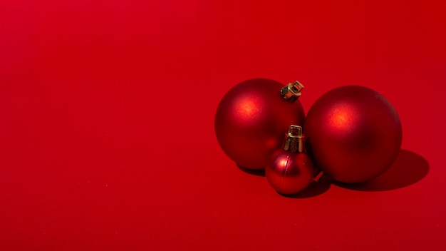 Red Christmas balls on red table